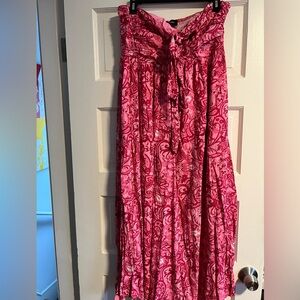 Women’s pink maxi dress, halter neck, sleeveless, backless flowy boho style.